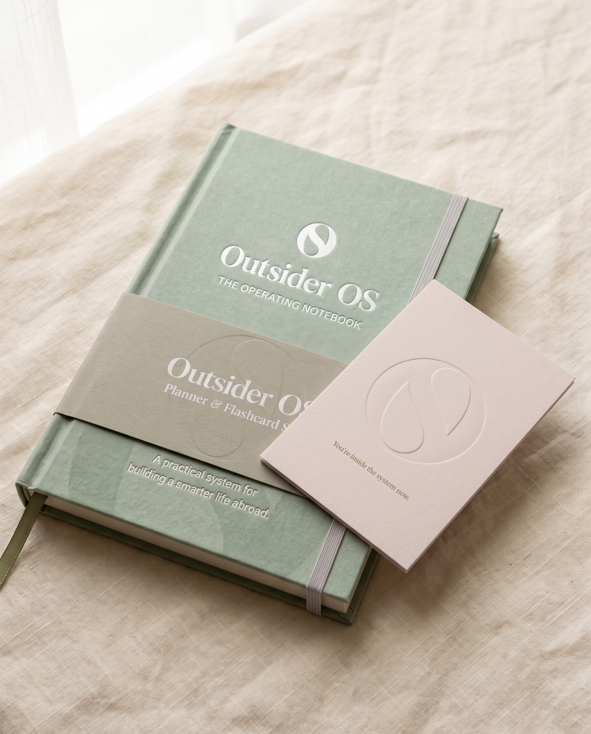 Debossed Outsider OS emblem close-up